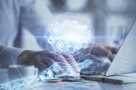 Businessman with computer background with technology theme hologram. Concept of hightech. Multi...