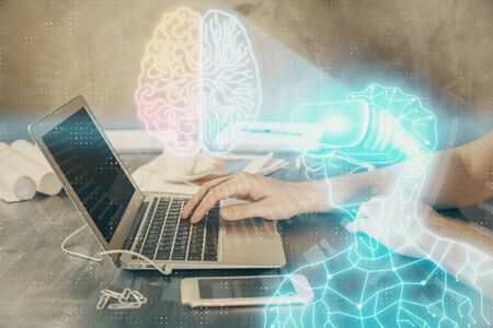 AR hologram with man working on computer on background. Augmented reality concept. Double exposure.