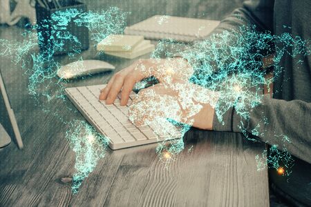 Social network theme hologram with businessman working on computer on background. Concept of world wide web. Multi exposure.の写真素材