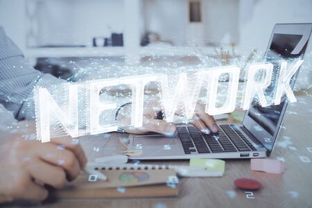 Businessman working on Laptop with technology theme drawing. Concept of big data. Double exposure.の写真素材