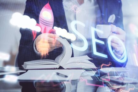 Man writing. With double exposure seo drawings.の写真素材