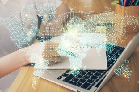 International business hud over woman's hands writing background. Concept of hard work. Double exposureの写真素材