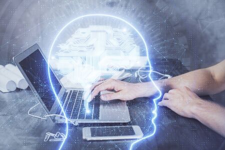 Man typing on keyboard background with brain hologram. Concept of big Data.