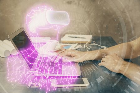 AR hologram with man working on computer on background. Augmented reality concept. Double exposure.