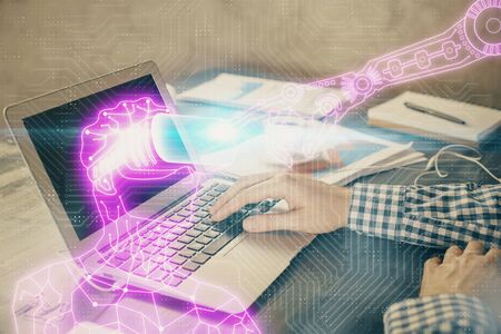 AR hologram with man working on computer on background. Augmented reality concept. Double exposure.