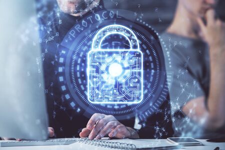 Multi exposure of lock icon with man working on computer on background. Concept of network...