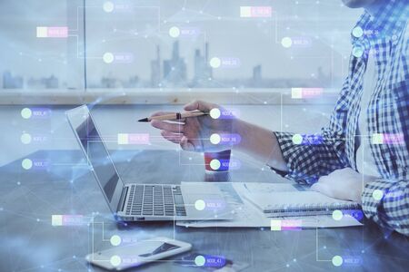 Businessman working on Laptop with technology theme drawing. Concept of big data. Double exposure.の写真素材