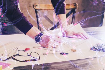 Interconnected neuron cells with glowing link knots in electrical pulses with man working background. Double exposure.の写真素材