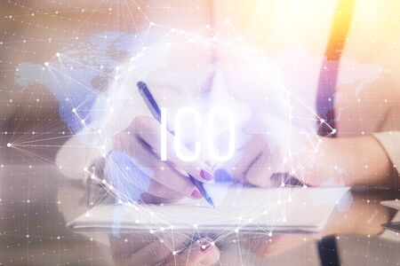 Cryptocurrency hologram over woman's hands writing background. Concept of blockchain. Double exposureの写真素材