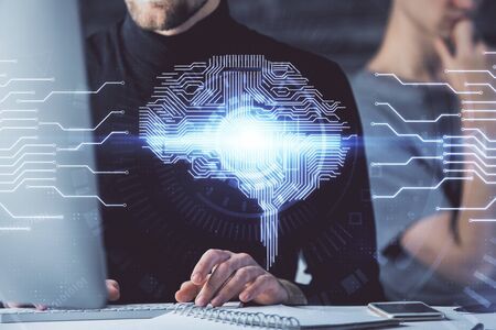 Businessman with computer background with brain theme hologram. Concept of brainstorm. Multi exposure.の写真素材