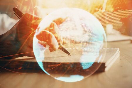 International business hud over woman's hands writing background. Concept of hard work. Double exposureの写真素材