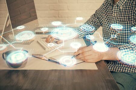 Social network theme hologram with businessman working on computer on background. Concept of world wide web. Double exposure.の写真素材