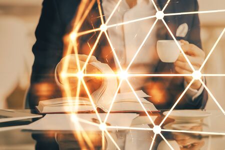 Man's hands working with notes background. Social networking scheme . Mixed media. Global business. Multi exposure.の写真素材