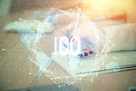 Cryptocurrency hologram over woman's hands writing background. Concept of blockchain. Double exposureの写真素材