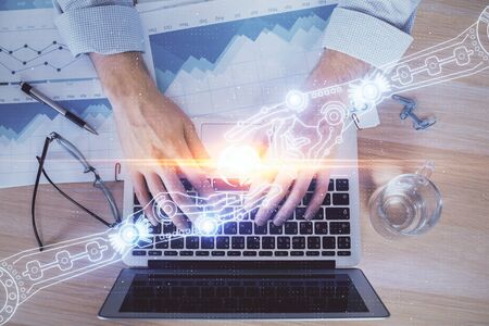 Businessman with computer background with technology theme hologram. Concept of big data. Double exposure.の写真素材