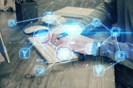 Social network theme hologram with businessman working on computer on background. Concept of world wide web. Multi exposure.の写真素材
