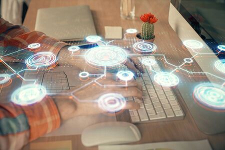 Social network theme hologram with businessman working on computer on background. Concept of world wide web. Double exposure.の写真素材