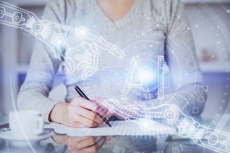 Double exposure of writing hand on background with data solution technology hologram. Ai concept.の写真素材