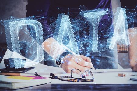 Man's hands with technology theme multi exposure icons. Concept of big data.