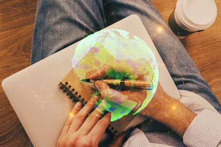 Man's hands working with notes background. Social networking scheme . Mixed media. Global business....