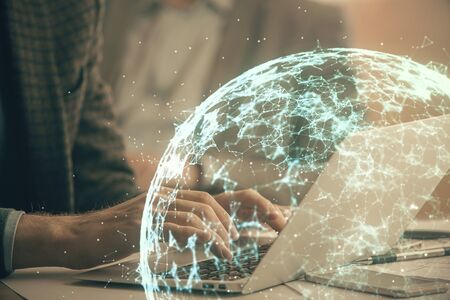 Social network theme hologram with businessman working on computer on background. Concept of world...