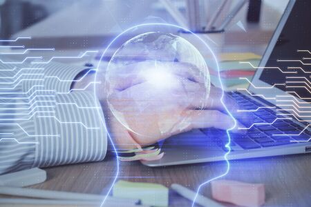 Man typing on keyboard background with brain hologram. Concept of big Data. Double exposure.の写真素材