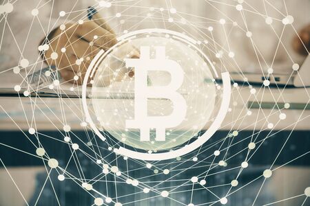 Cryptocurrency hologram over woman's hands writing background. Concept of blockchain. Double exposureの写真素材