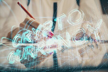 Cryptocurrency hologram over woman's hands writing background. Concept of blockchain. Double exposureの写真素材