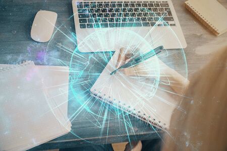 International business hud over woman's hands writing background. Concept of hard work. Double exposureの写真素材