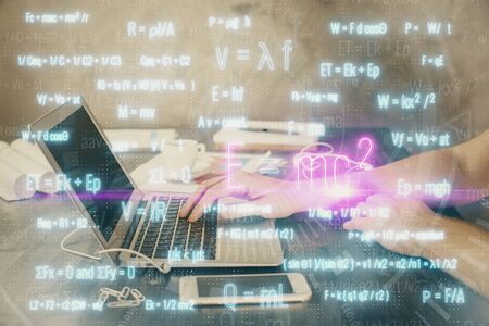 Science formula hologram with man working on computer on background. Education concept. Double...