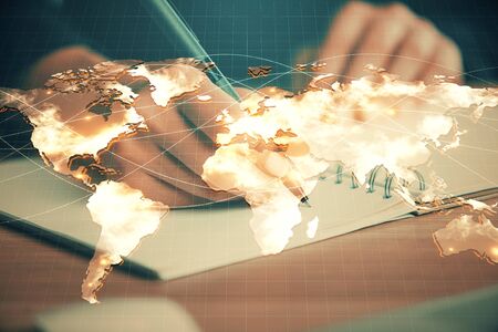 International business hologram over woman's hands taking notes background. Concept of success. Double exposureの写真素材