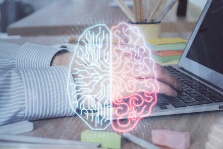 Man typing on keyboard background with brain hologram. Concept of big Data. Double exposure.の写真素材