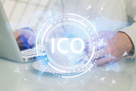 Blockchain theme hud with businessman working on computer on background. Concept of crypto chain. Multi exposure.の写真素材