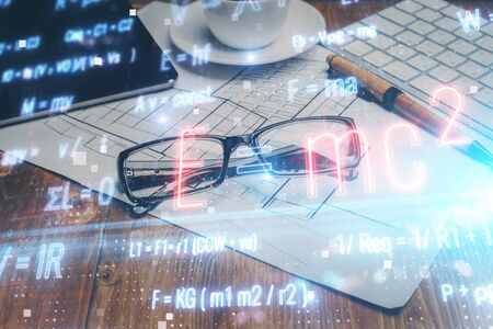 Formulas drawing with glasses on the table background. Concept of science. Double exposure.