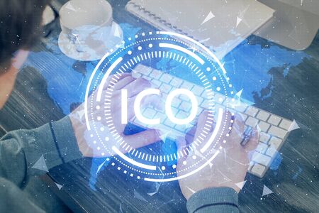 Blockchain theme hud with businessman working on computer on background. Concept of crypto chain. Multi exposure.の写真素材