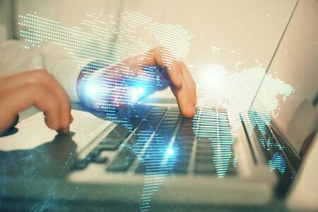 Social network theme hologram with businessman working on computer on background. Concept of world wide web. Double exposure.の写真素材