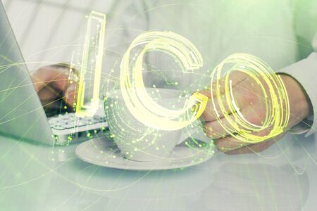 Blockchain theme hud with businessman working on computer on background. Concept of crypto chain. Multi exposure.の写真素材