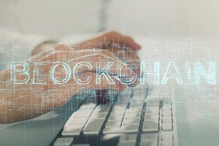 Crypto currency theme hologram with businessman working on computer on background. Concept of...