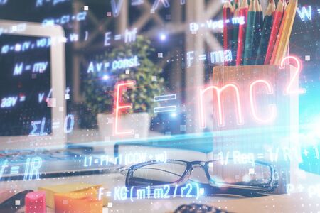 Formulas drawing with glasses on the table background. Concept of science. Double exposure.