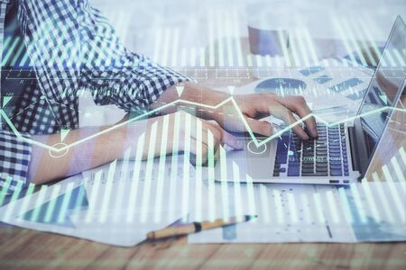 Businessman working on Laptop with technology theme drawing. Concept of big data. Double exposure.の写真素材