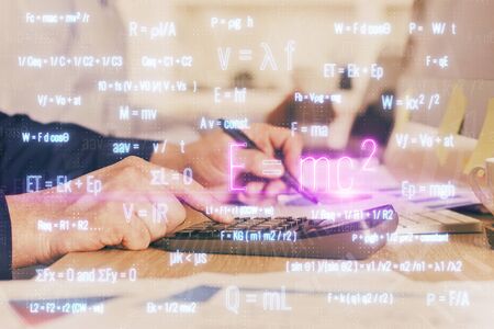 Student or teacher with mathematical and scientific formulas. Concepts of education. Symbols and equations on a virtual interface. Double exposure.の写真素材