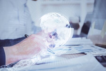 Man's hands with international data global network topic double exposure icon. Concept of globalization.の写真素材
