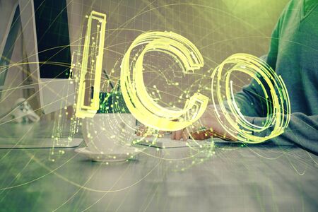 Blockchain theme hud with businessman working on computer on background. Concept of crypto chain. Multi exposure.の写真素材