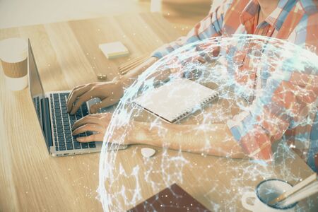 Social network theme hologram with businessman working on computer on background. Concept of world wide web. Double exposure.の写真素材