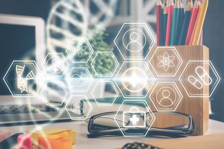 DNA drawing with glasses on the table background. Concept of bioengineering. Double exposure.の写真素材