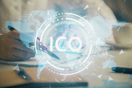 Cryptocurrency hologram over woman's hands writing background. Concept of blockchain. Double exposureの写真素材