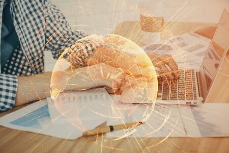 Social network theme hologram with businessman working on computer on background. Concept of world wide web. Multi exposure.の写真素材