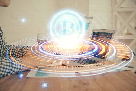 Blockchain theme hud with businessman working on computer on background. Concept of crypto chain. Multi exposure.の写真素材