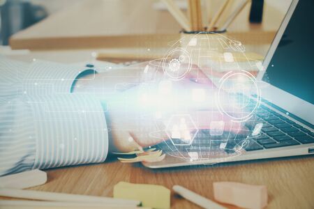 Social network theme hologram with businessman working on computer on background. Concept of world wide web. Multi exposure.の写真素材