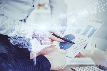 Man's hands with atificial intelligence double exposure icon. Concept of computer learning.の写真素材